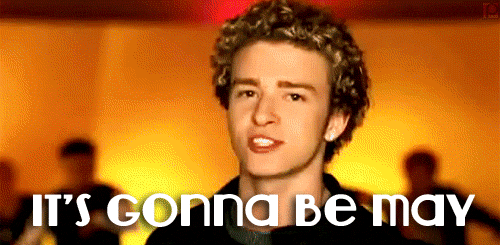 Close up of a young Justin Timberlake singing with the words "It's Gonna be May" at the bottom
